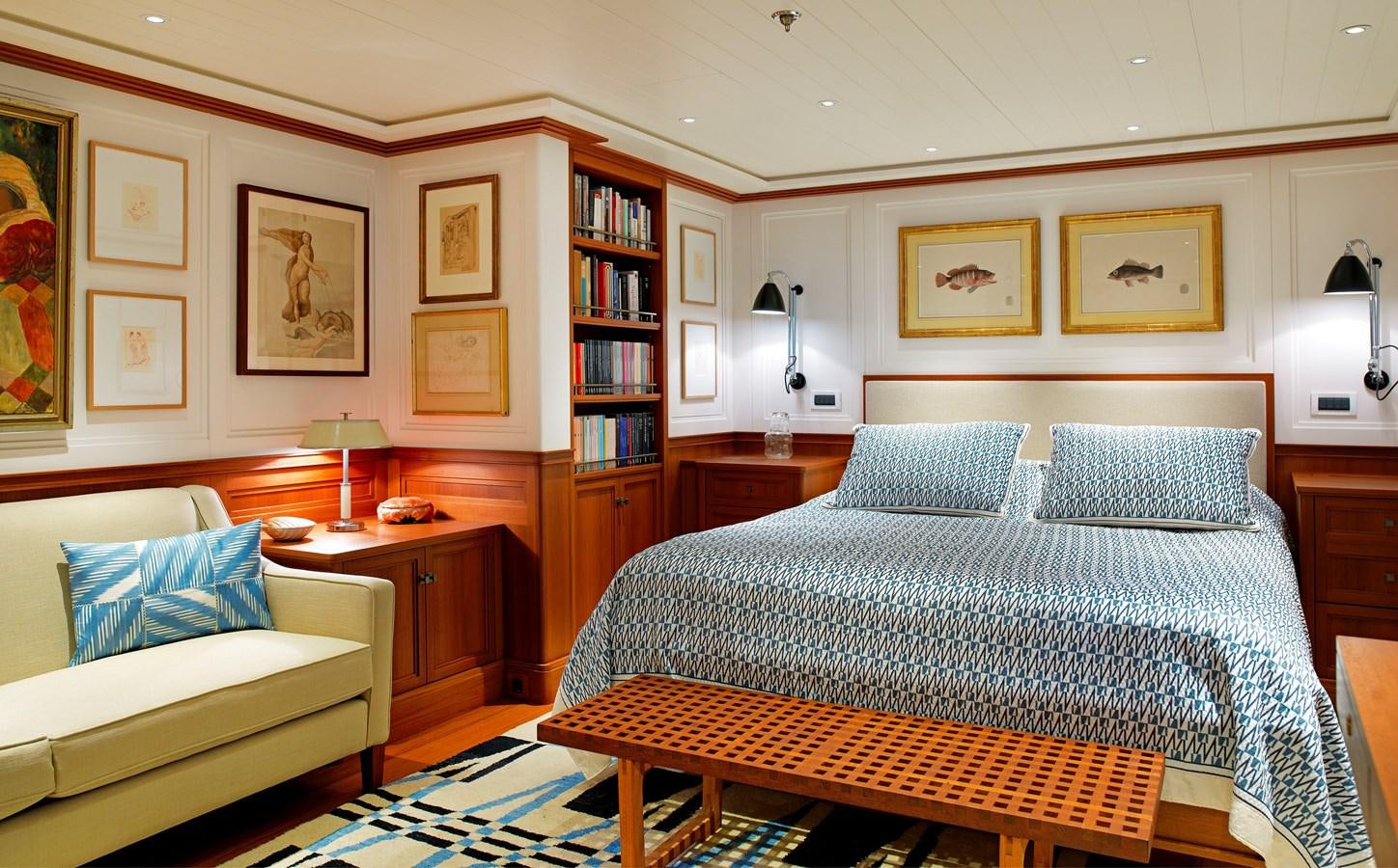 a bedroom with a bed and a couch aboard MESERRET II Yacht for Sale