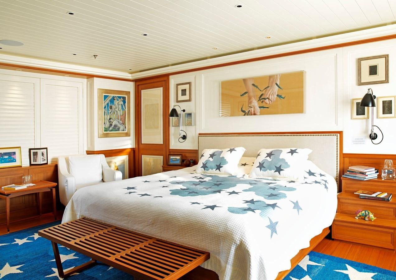 a bedroom with a bed and a desk aboard MESERRET II Yacht for Sale