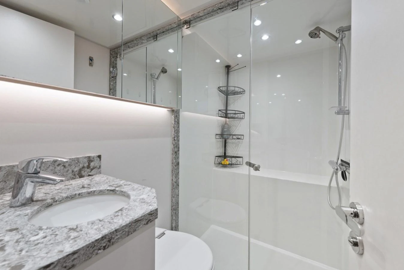 a bathroom with a glass shower aboard EVERGLADE Yacht for Sale