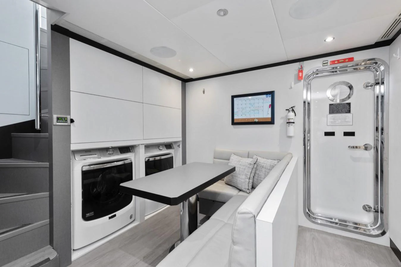a room with a bed and a television aboard EVERGLADE Yacht for Sale