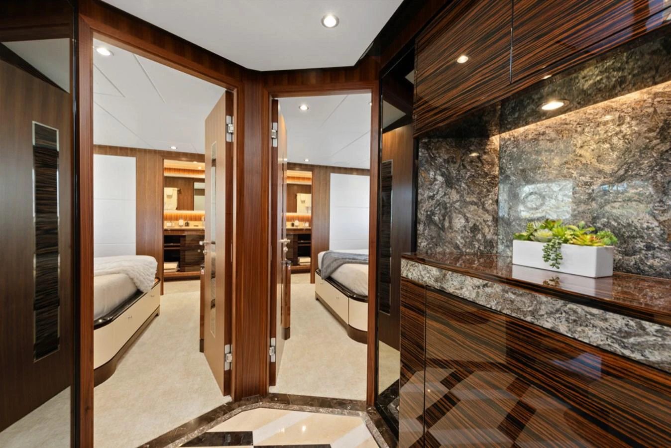 a room with a large mirror aboard EVERGLADE Yacht for Sale