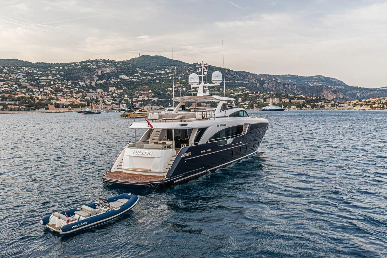 a boat and a small boat in the water aboard AVALON Yacht for Sale