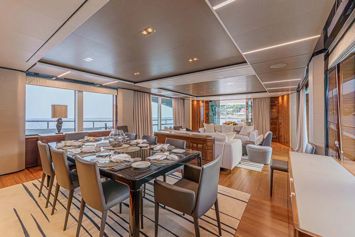 a large dining room with a large table and chairs aboard AVALON Yacht for Sale