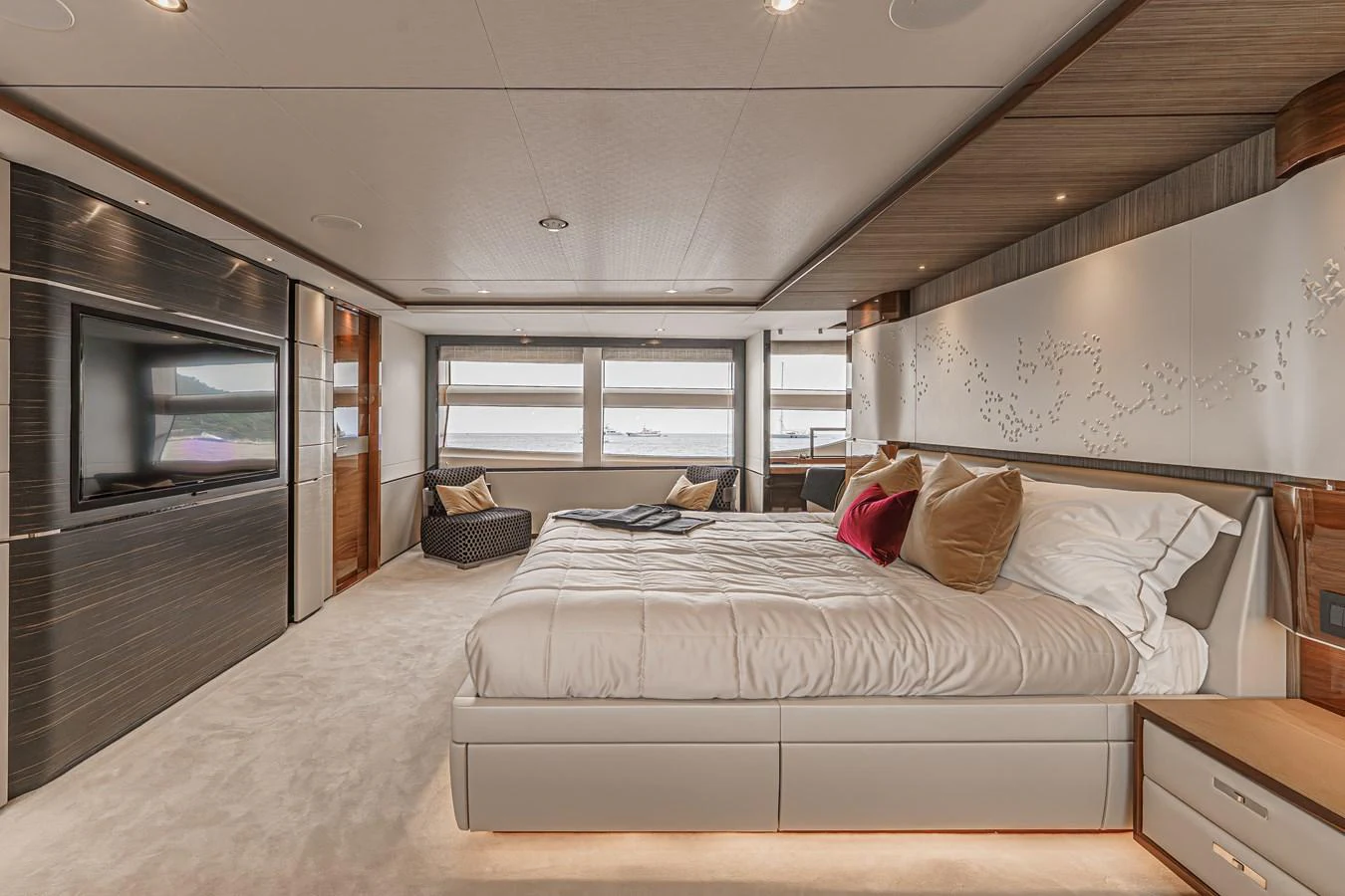 a bedroom with a bed and a tv aboard AVALON Yacht for Sale