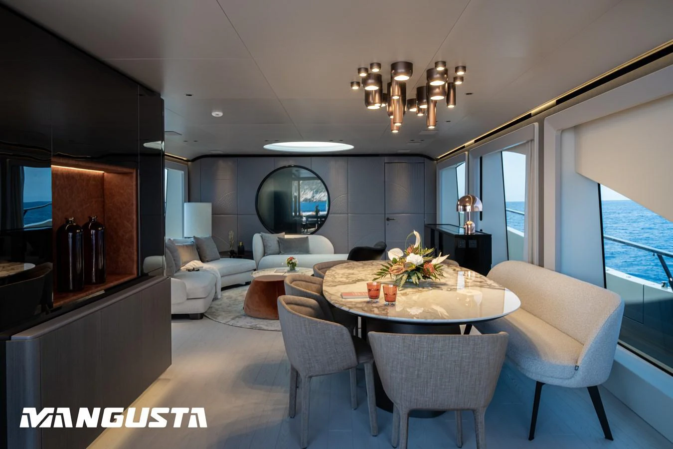 a dining room with a table and chairs aboard EREIVA Yacht for Sale