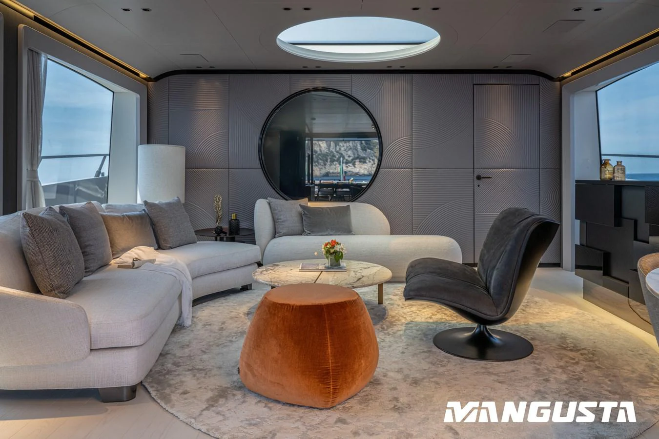 a living room with a couch and a coffee table aboard EREIVA Yacht for Sale
