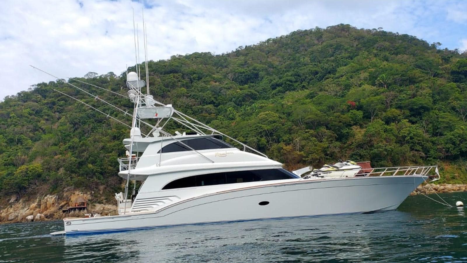 a white boat on water aboard RUMBERA Yacht for Sale