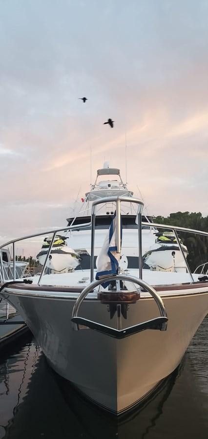 a boat with a bird flying above it aboard RUMBERA Yacht for Sale