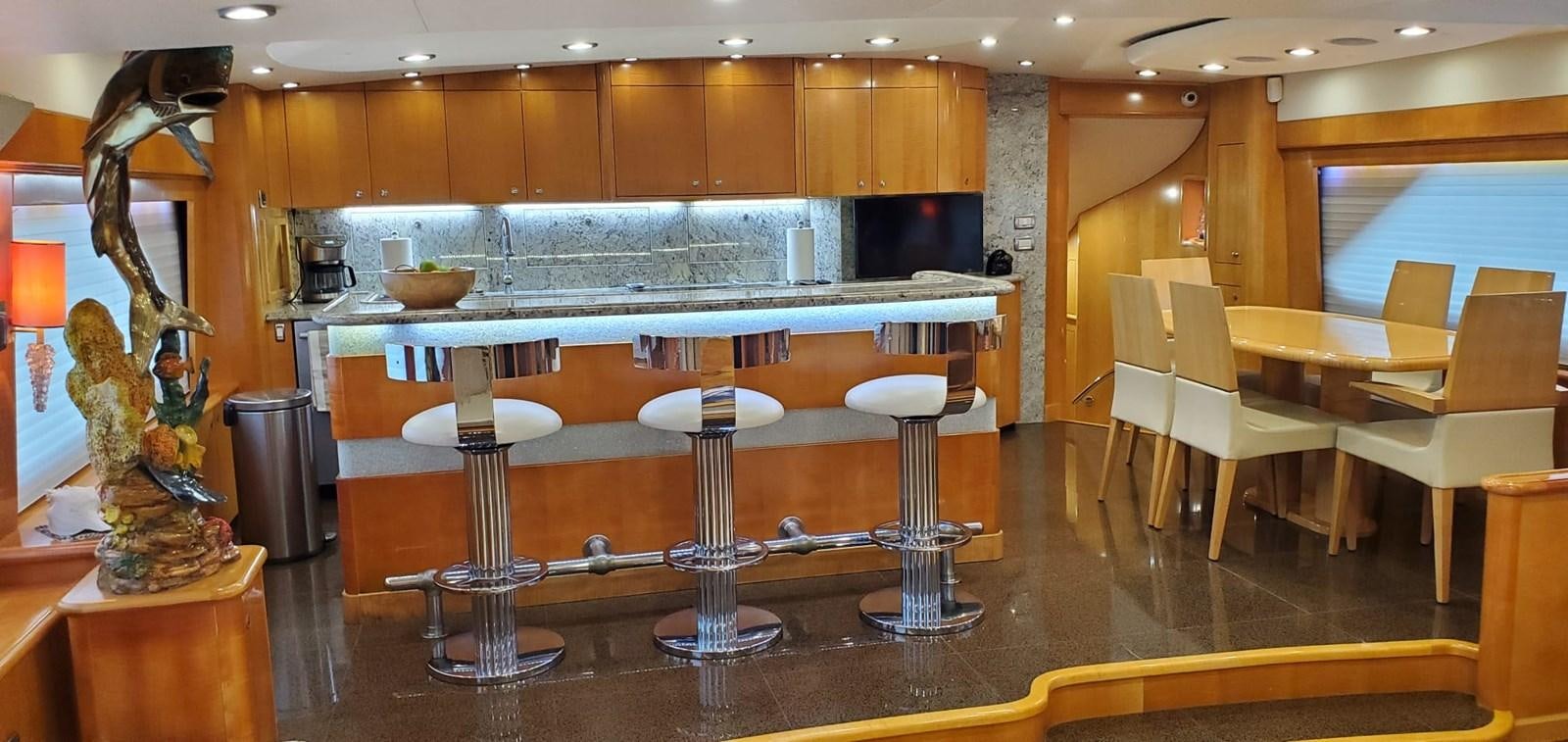 a kitchen with a large island aboard RUMBERA Yacht for Sale