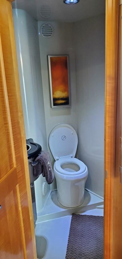 a toilet in a bathroom aboard RUMBERA Yacht for Sale