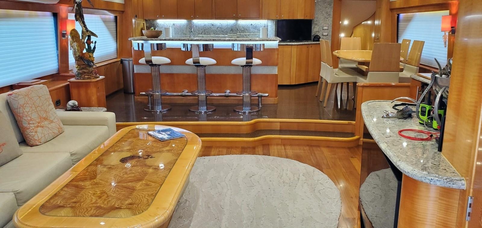 a room with a table and chairs aboard RUMBERA Yacht for Sale