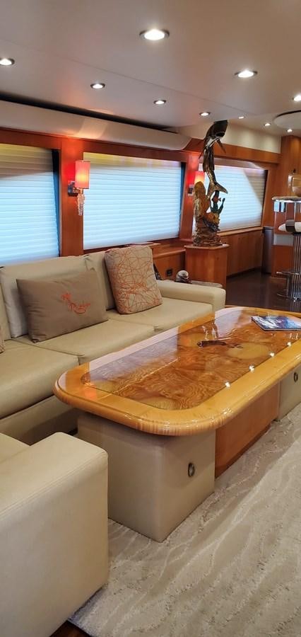 a living room with a couch and a coffee table aboard RUMBERA Yacht for Sale