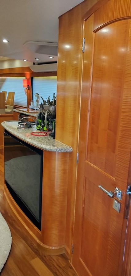a kitchen with a wood cabinet aboard RUMBERA Yacht for Sale