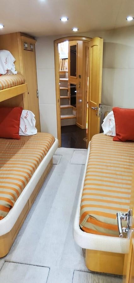 a bathroom with a bed and a mirror aboard RUMBERA Yacht for Sale