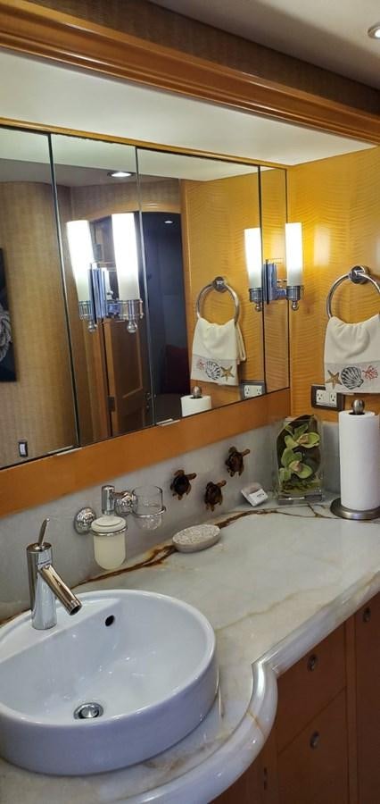 a bathroom with a large mirror aboard RUMBERA Yacht for Sale