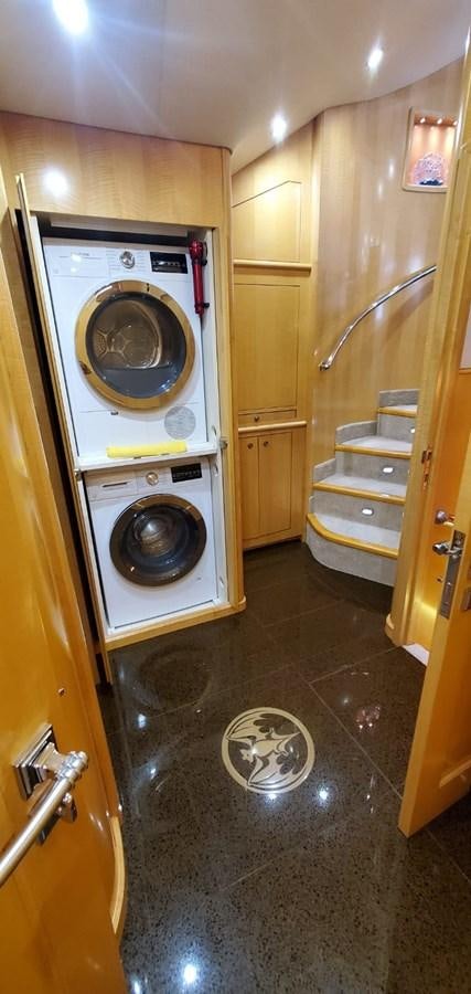 a washer and dryer in a bathroom aboard RUMBERA Yacht for Sale