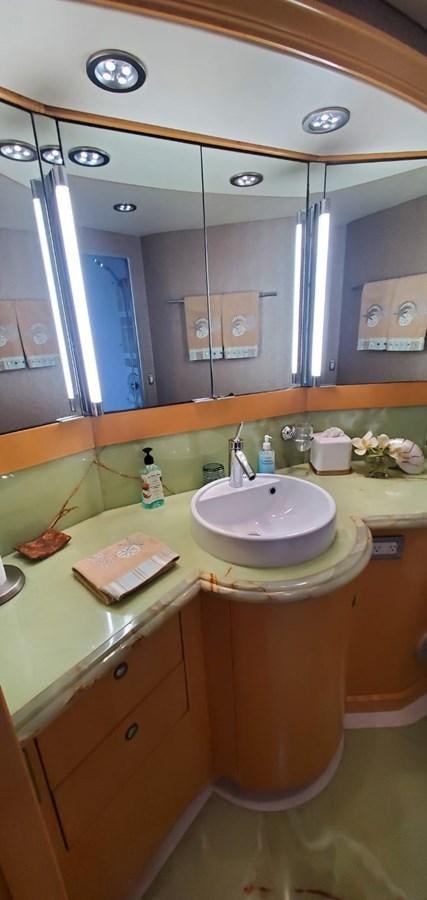a bathroom with a large mirror aboard RUMBERA Yacht for Sale