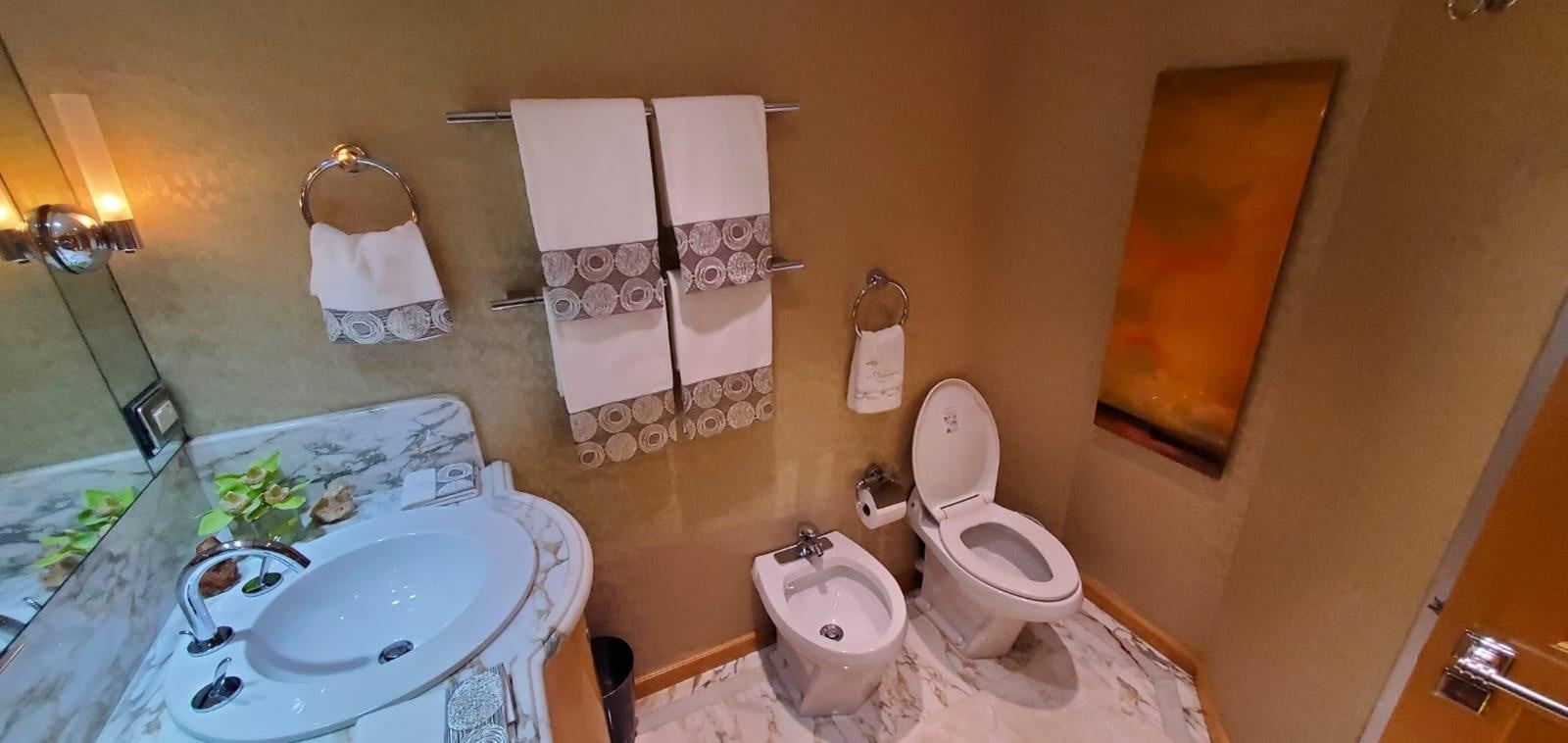 a bathroom with a toilet and sink aboard RUMBERA Yacht for Sale