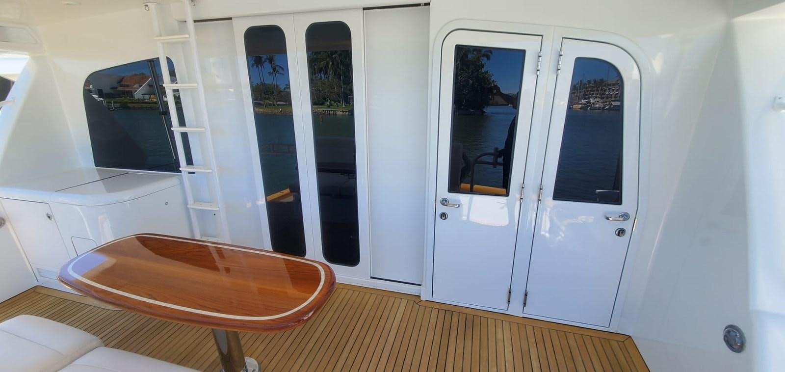 a room with a bed and a table aboard RUMBERA Yacht for Sale