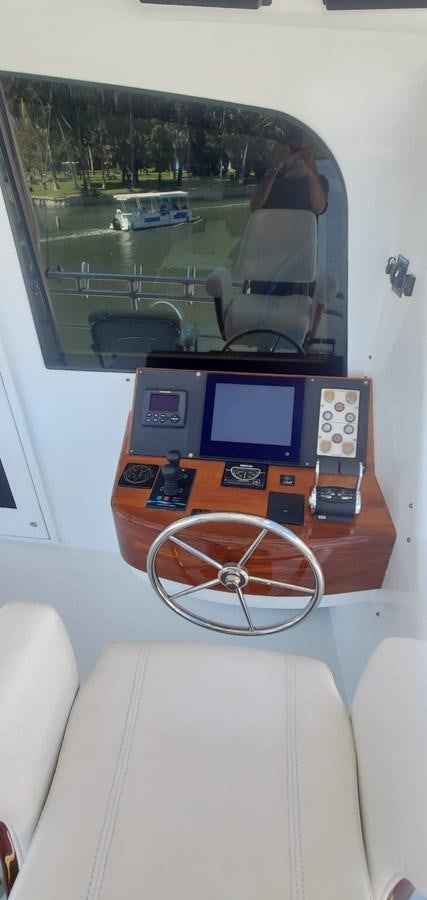 a tv on a table aboard RUMBERA Yacht for Sale