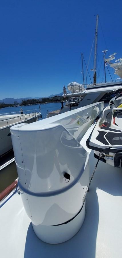 a white boat with a white circle on it aboard RUMBERA Yacht for Sale