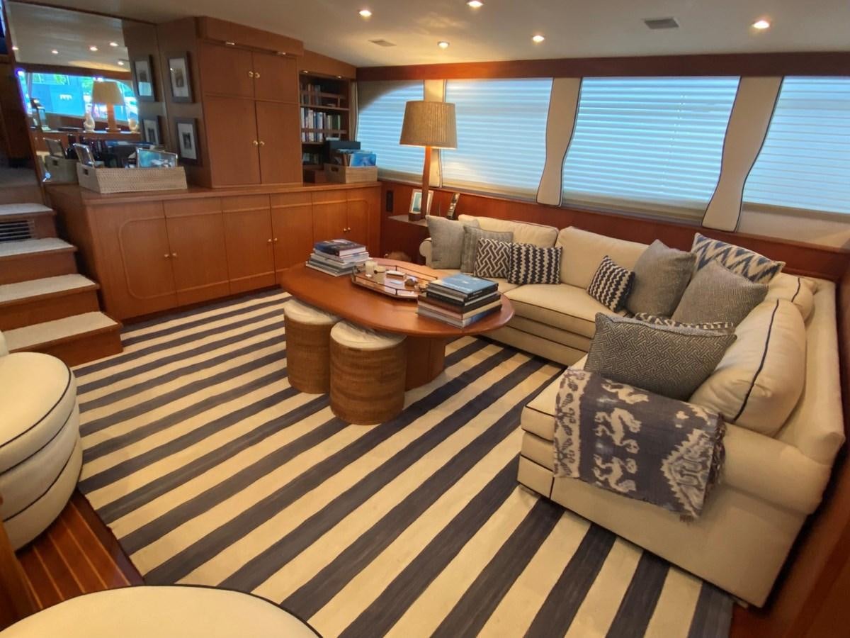 a living room with a couch and a coffee table aboard SHARK Yacht for Sale