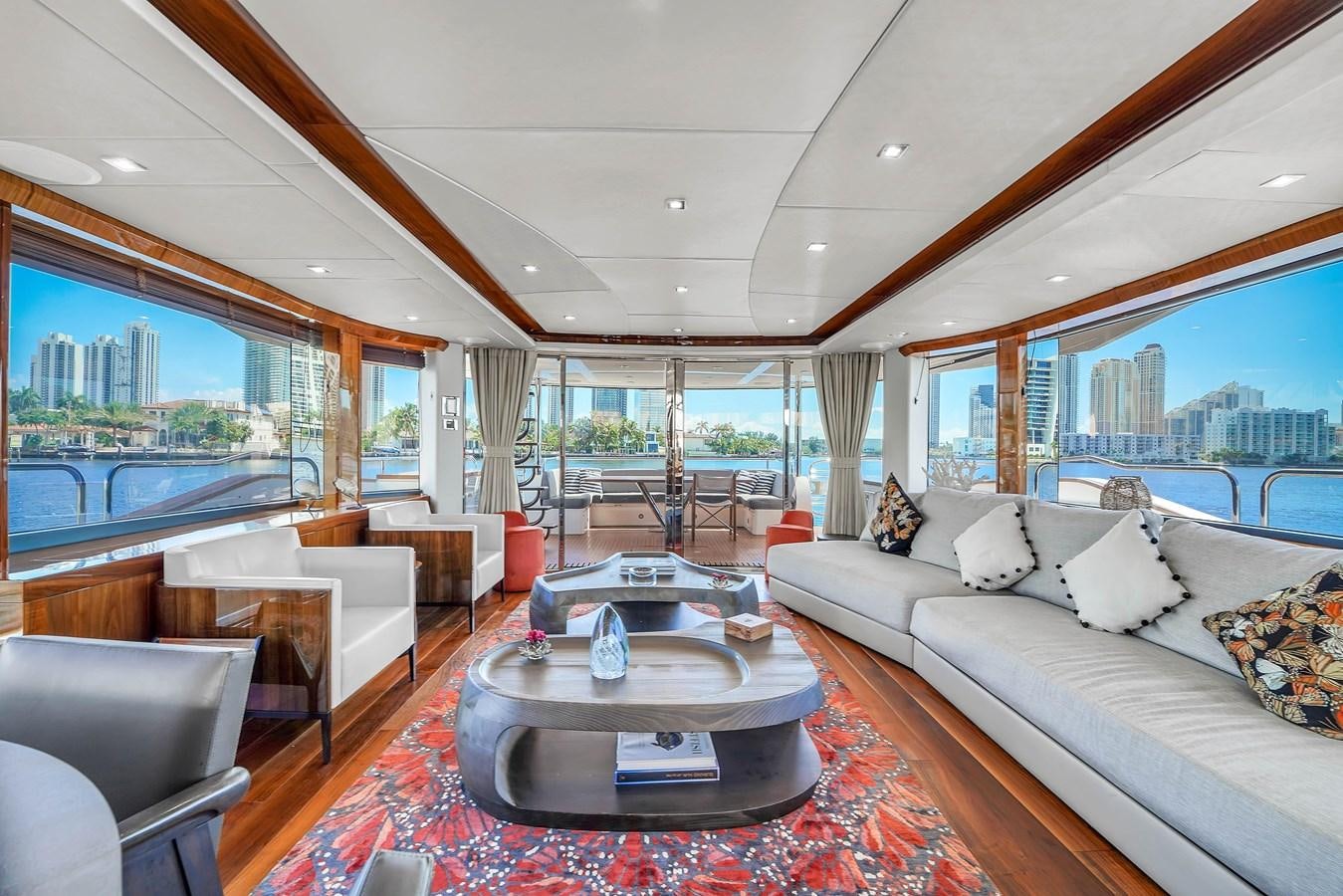 a living room with a large window aboard 92' SUNSEEKER 2016 Yacht for Sale