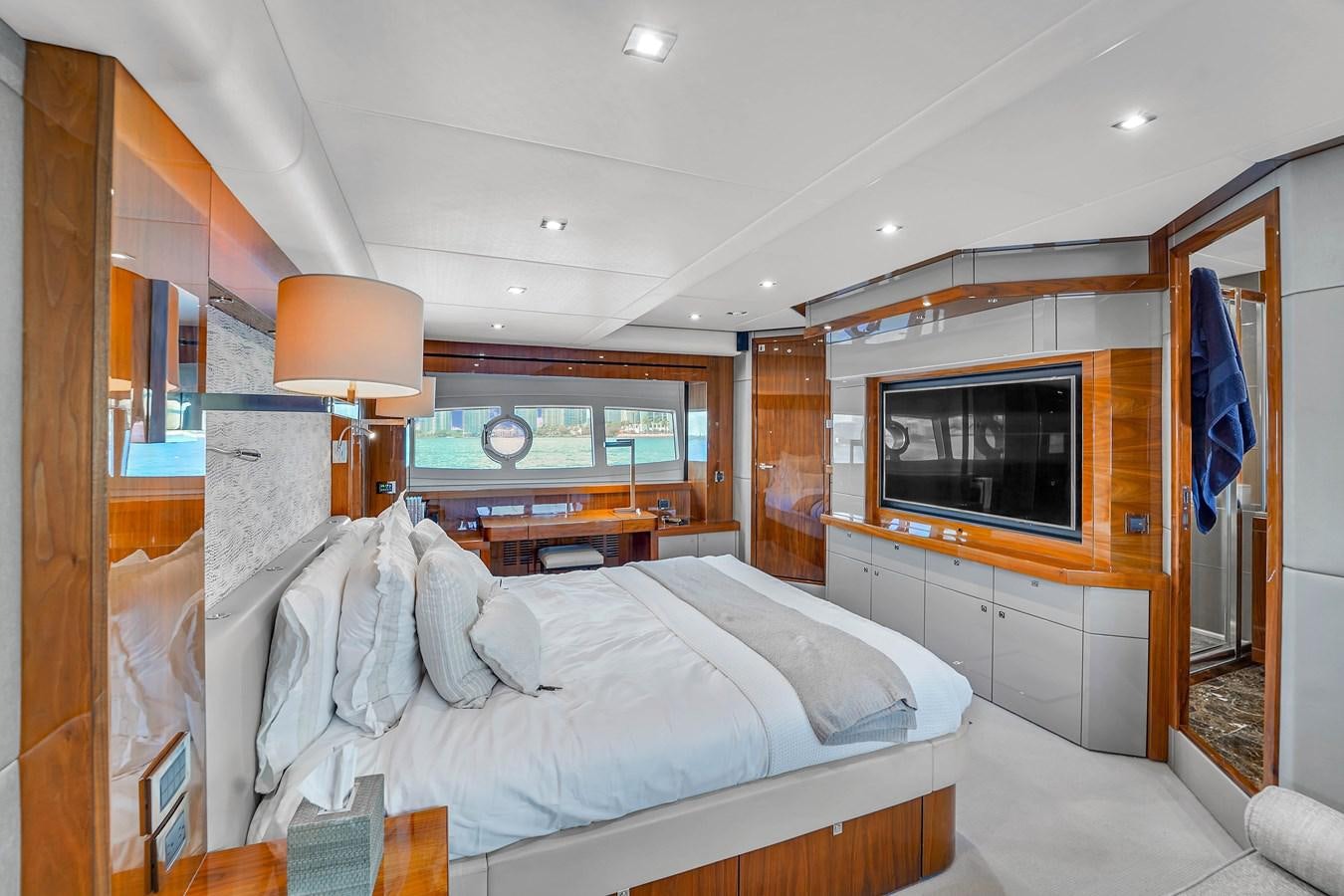 a bedroom with a bed and a television aboard 92' SUNSEEKER 2016 Yacht for Sale