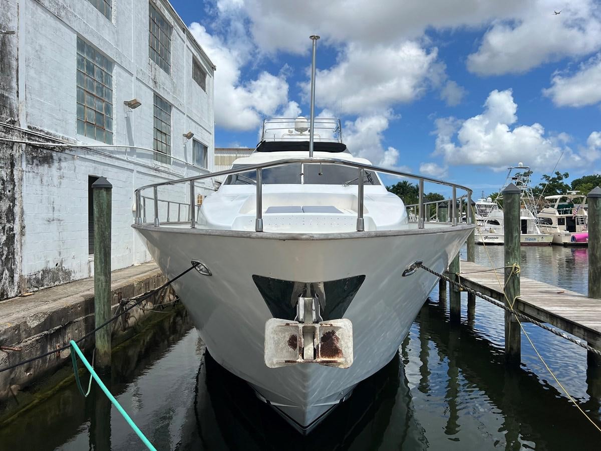 a boat docked at a pier aboard ØES3 Yacht for Sale