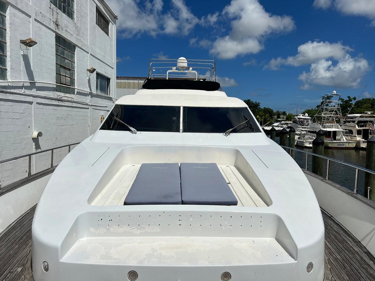 a white yacht in a harbor aboard ØES3 Yacht for Sale