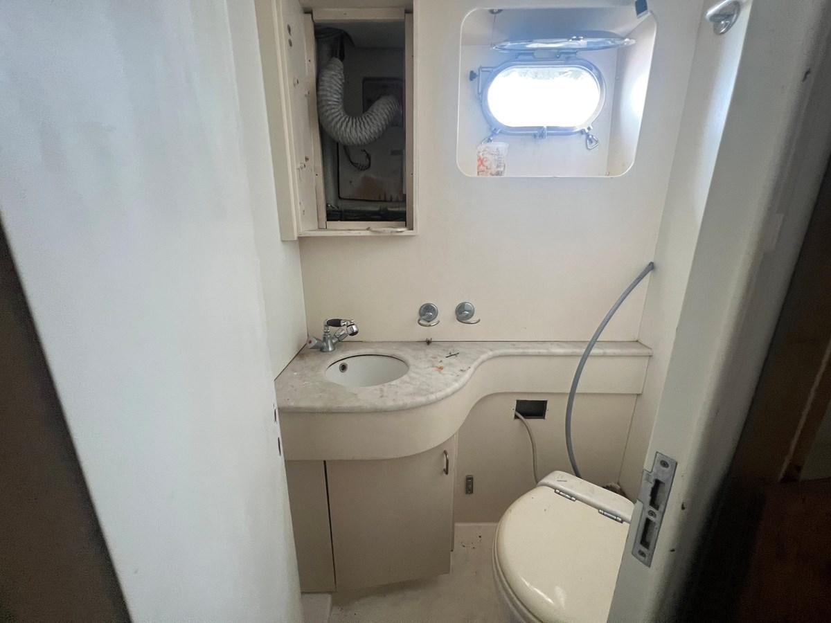 a small bathroom with a sink and a toilet aboard ØES3 Yacht for Sale