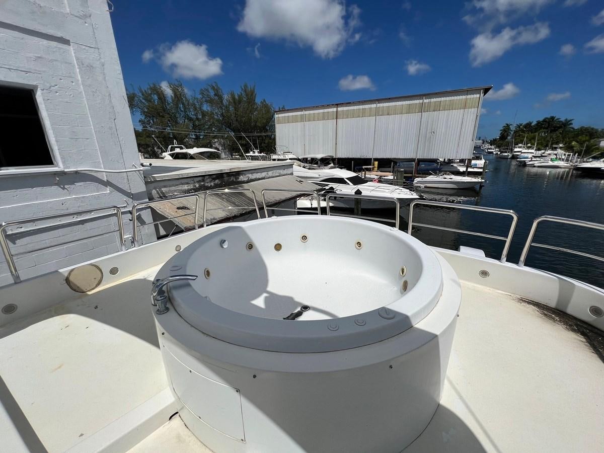 a large white pool with a round white object on it aboard ØES3 Yacht for Sale