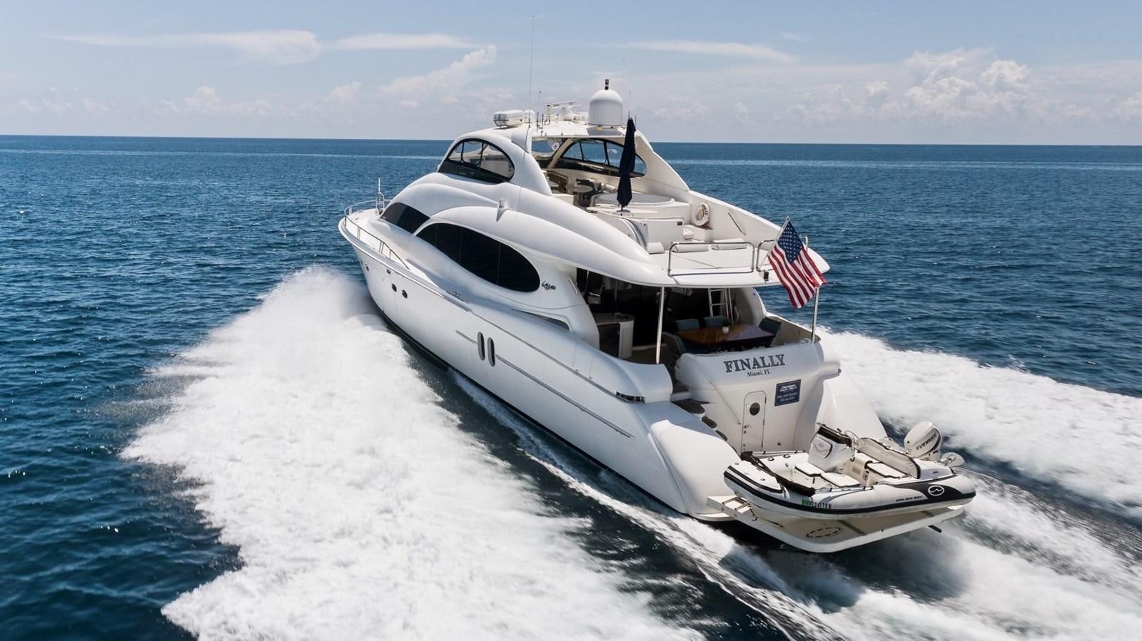 a white yacht on the water aboard FINALLY Yacht for Sale