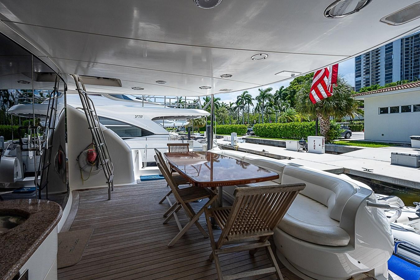 a deck with chairs and tables aboard FINALLY Yacht for Sale