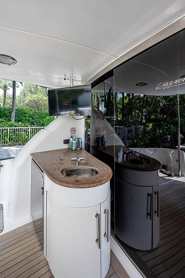 a kitchen with a sink and a window aboard FINALLY Yacht for Sale