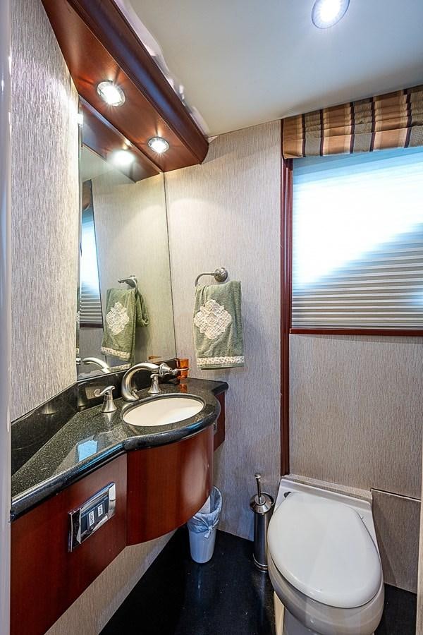 a bathroom with a sink and a toilet aboard FINALLY Yacht for Sale