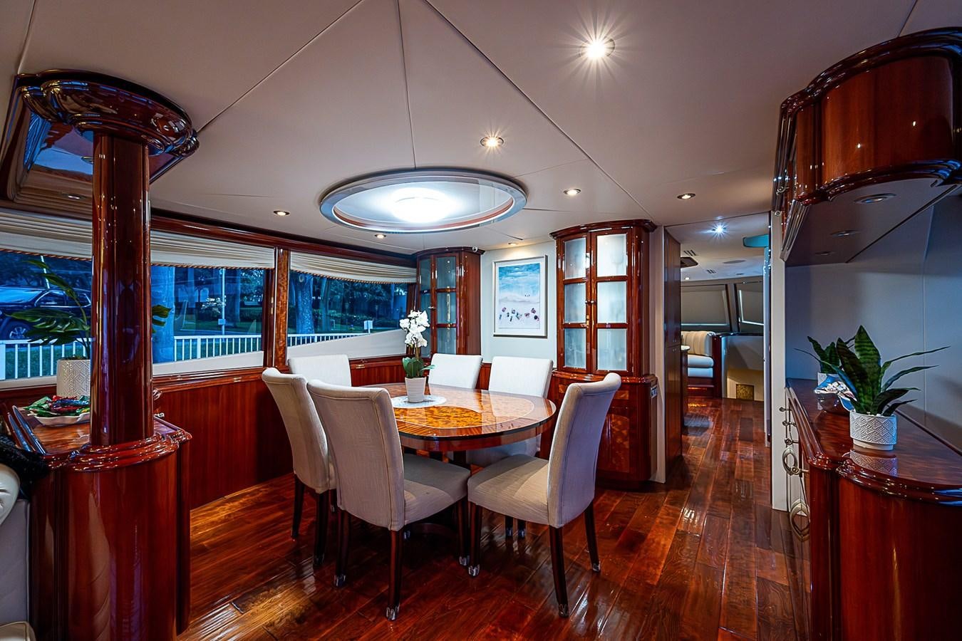 a dining room with a table and chairs aboard FINALLY Yacht for Sale
