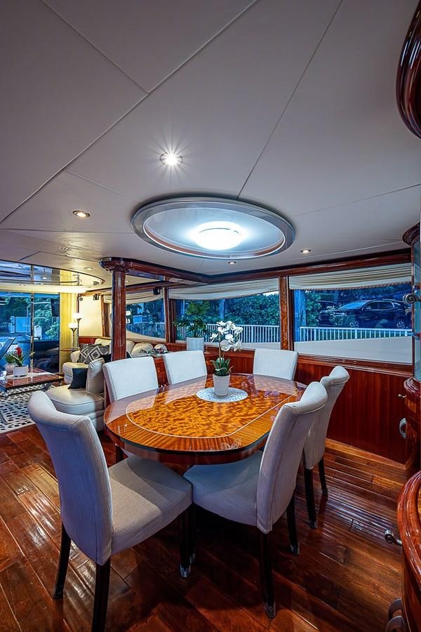 a dining room with a table and chairs aboard FINALLY Yacht for Sale
