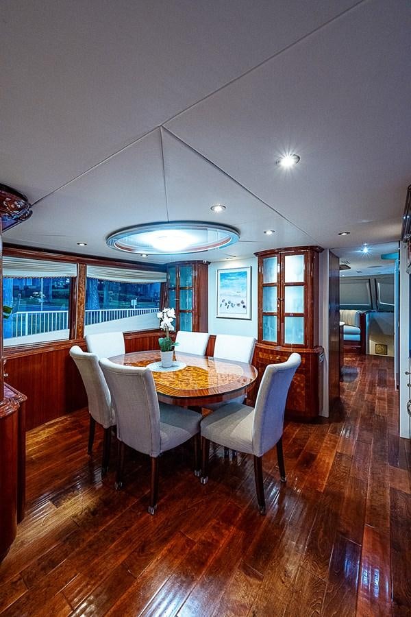 a dining room with a table and chairs aboard FINALLY Yacht for Sale
