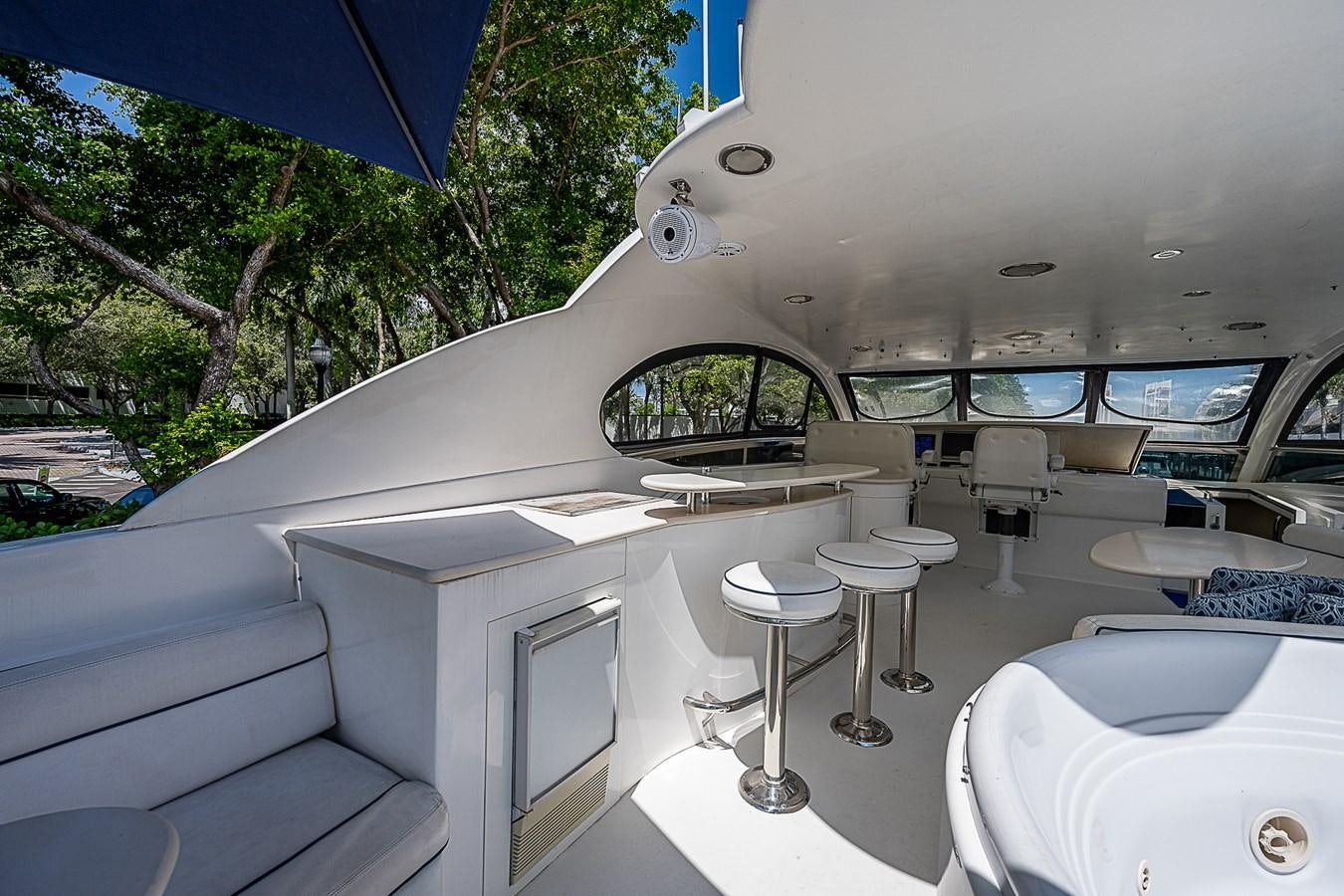 a room with a couple of tables and chairs aboard FINALLY Yacht for Sale