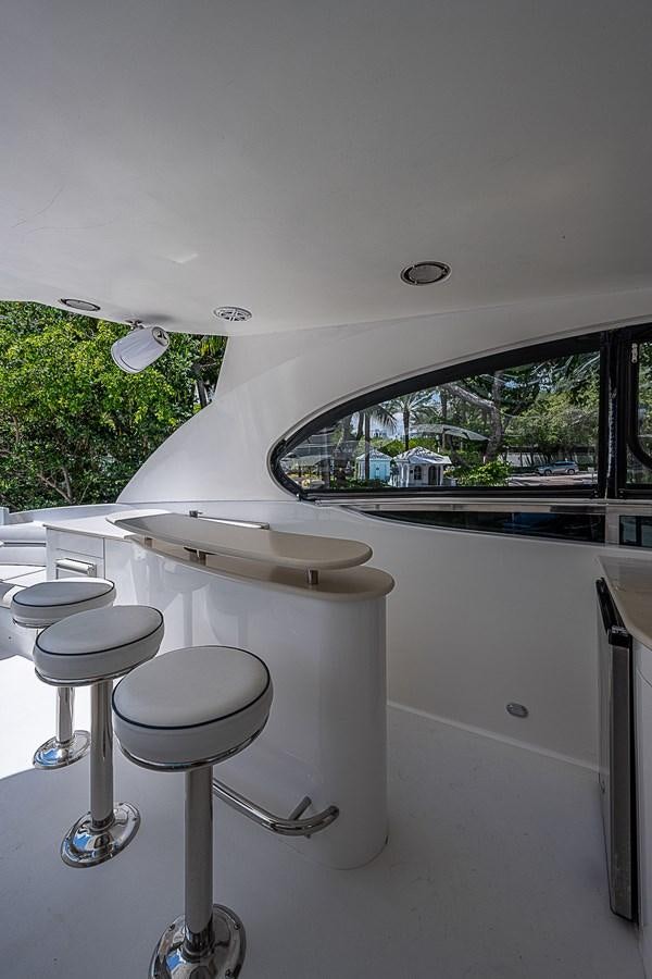 a white table with stools aboard FINALLY Yacht for Sale