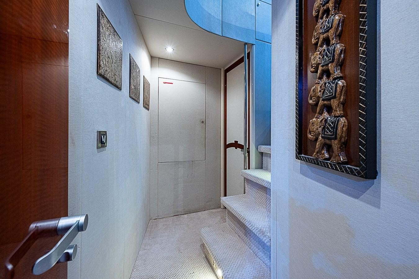 a hallway with a painting on the wall aboard FINALLY Yacht for Sale