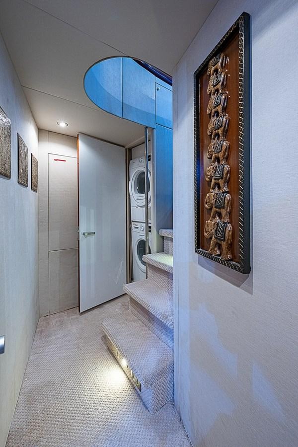 a hallway with blue walls aboard FINALLY Yacht for Sale