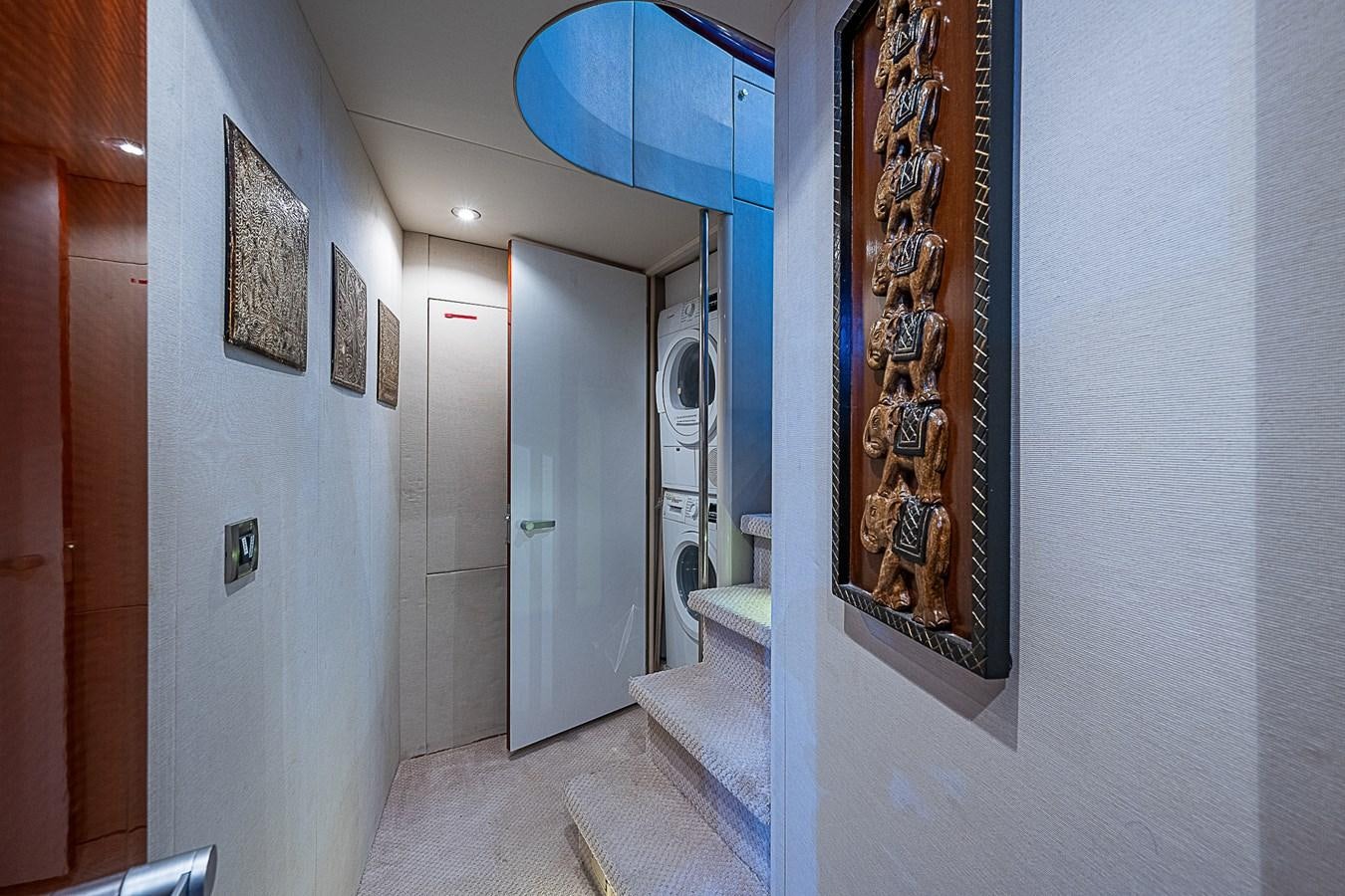 a hallway with a wall of mirrors aboard FINALLY Yacht for Sale