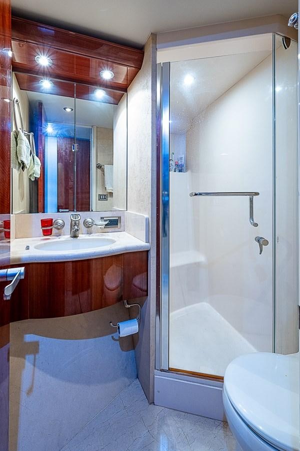 a bathroom with a shower and a sink aboard FINALLY Yacht for Sale