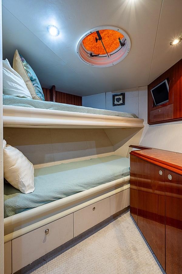 a bathroom with a large mirror above the sink aboard FINALLY Yacht for Sale