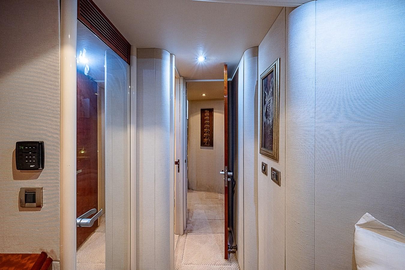 a hallway with a door and a mirror aboard FINALLY Yacht for Sale