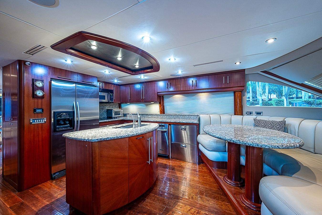 a kitchen with a bar and a table aboard FINALLY Yacht for Sale
