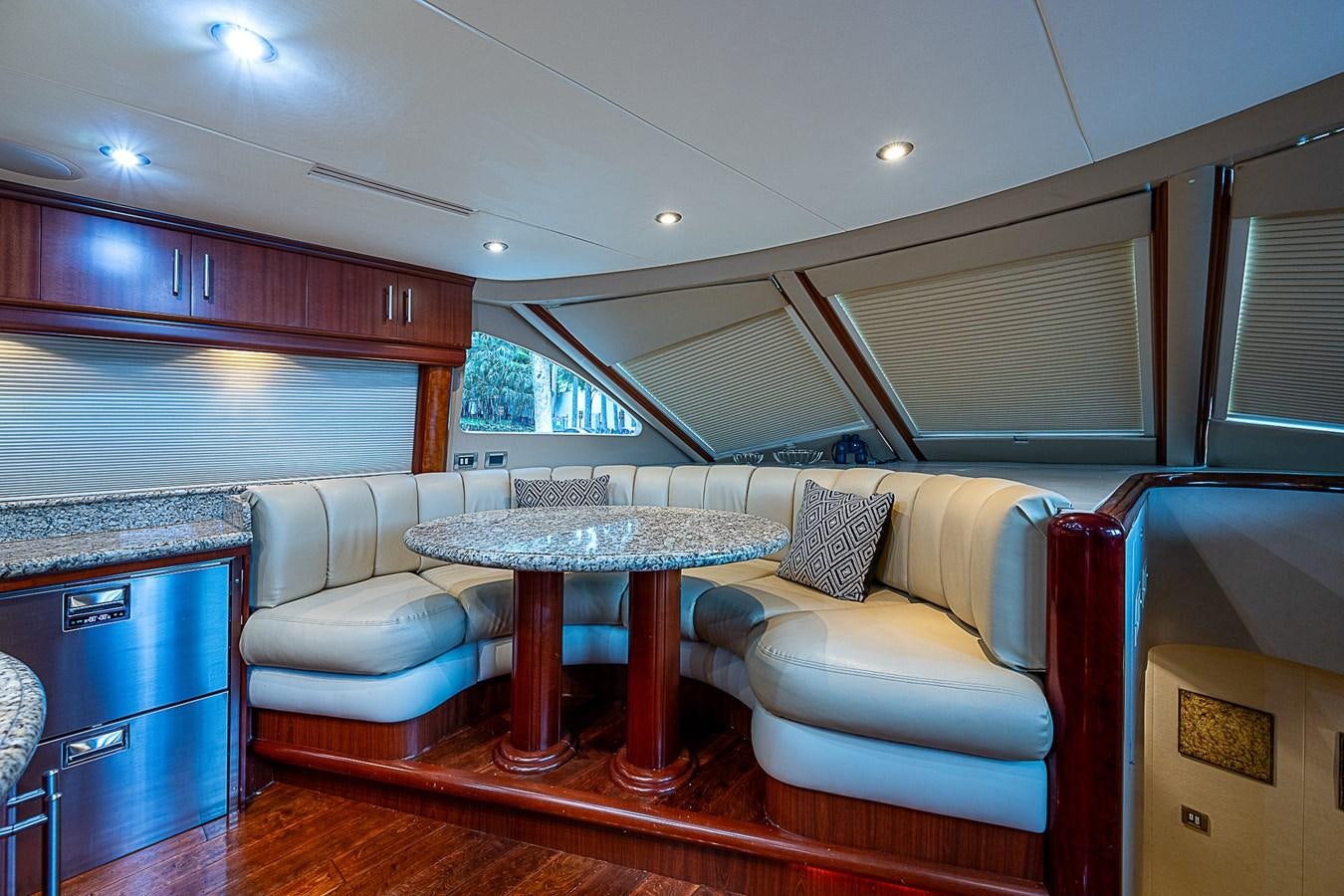 a living room with a couch and a table aboard FINALLY Yacht for Sale