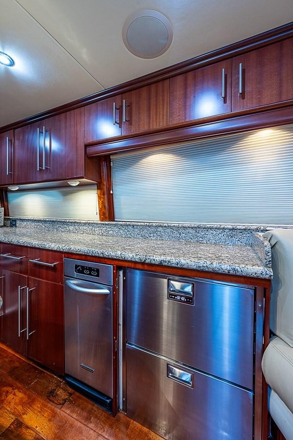 a kitchen with a stainless steel refrigerator aboard FINALLY Yacht for Sale